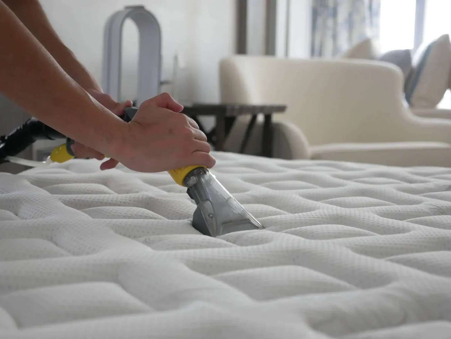 The headboard is gray, and a white electrical outlet is visible on the wall behind the mattress.