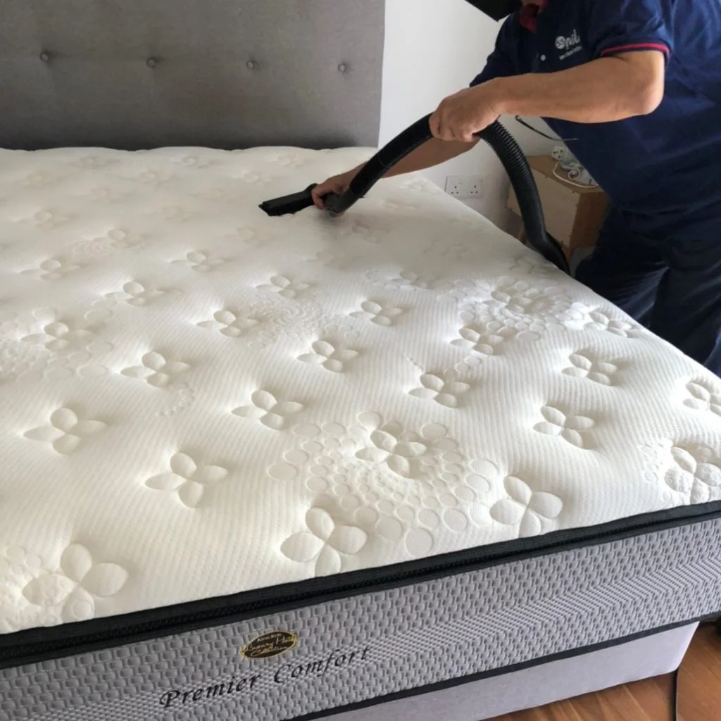 Mattress being vacuumed.